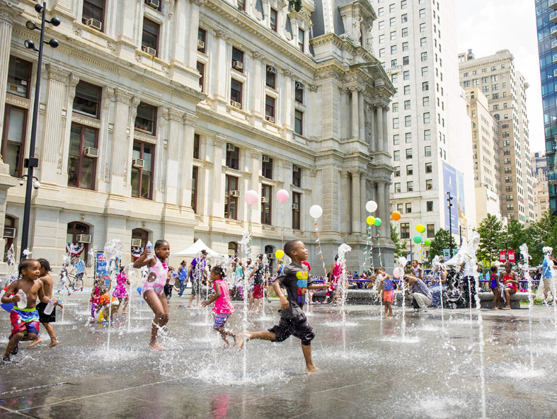 Children play in the fountain in Dilworth Park in Philadelphia. (Photo by M. Fischetti for Visit Philadelphia)